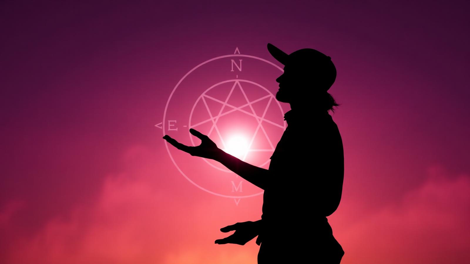 Silhouette holding an enneagram symbol at dusk